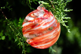 Christmas glass ornament with ash