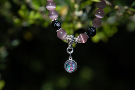 black flower bracelet with cremation ash