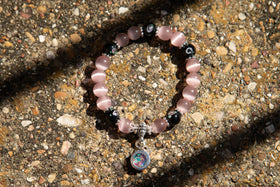 black flower bracelet with cremation ash