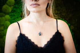 emerald green cremation jewelry with silver flower