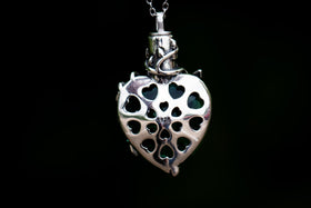 emerald green cremation jewelry with silver flower