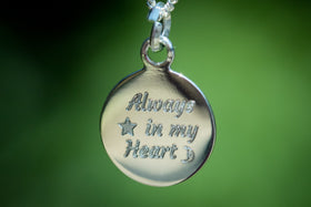 engraved silver charm