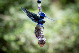hummingbird with silver keepsake pendant