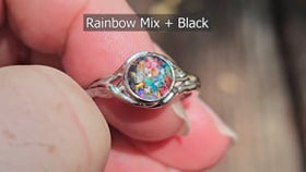 forked branch sterling silver cremation ring with opal being held