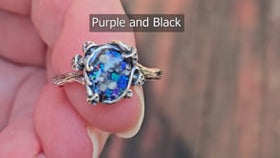 mushroom themed cremation ring with ashes from pets and people being held