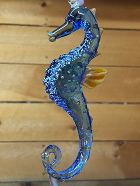 seahorse figurine with ash