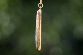 engravable footprint pendant side view