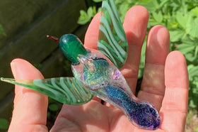 Dichroic glass hummingbird with cremation ash