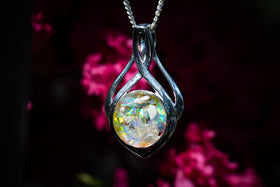 Celtic Drop Pendant. The pendant contains light yellow and dusk blue crushed opal. Necklace for ash, necklace for cremation ash, necklace for cremains, celtic necklace, silver necklace for ash