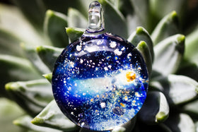 glass comet pendant with ash