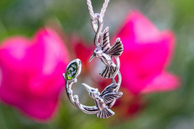 silver hummingbird with cremation ash