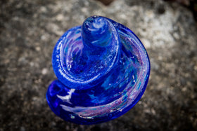 blue top view memorial glass with cremation ash