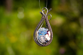 Wire wrapped alien world cremation jewelry