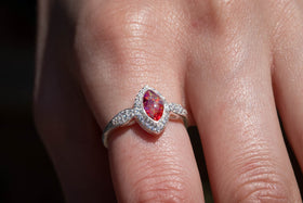 The photo is of our Bedazzled Cat Eye Cremation Ring on a model's hand.. It is a zircon studded, sterling silver ring with a cabochon comprised of crushed opal and cremation ash. The stone in this image is red and magenta. Sterling Silver Ring, Sterling Silver Cremation Jewelry, Jewelry for Ash, Cubic Zirconia Ring, Classic Jewelry Style Ring, Ring for Cremation Ash