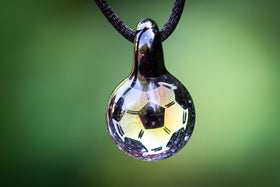 glass soccer ball with ashes