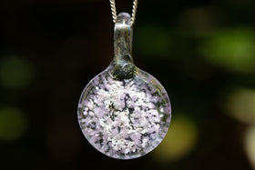 icy pendant with cremation ash