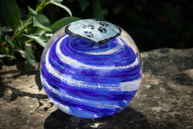 glass orb with cremation ash in blue