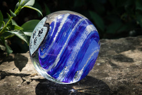 glass orb with cremation ash side