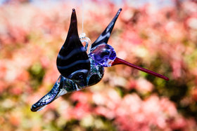 purple dichroic hummingbird with cremation ash