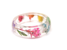 wildflower ring with cremation ash from pets on white background