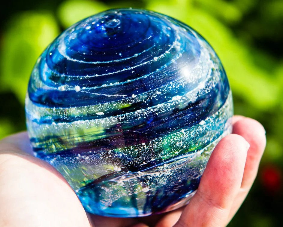 glass orb with ash