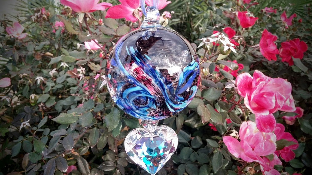 Crystal memorial ornament for a loved dog with a blue swirled glass ball and a hanging clear crystal heart.