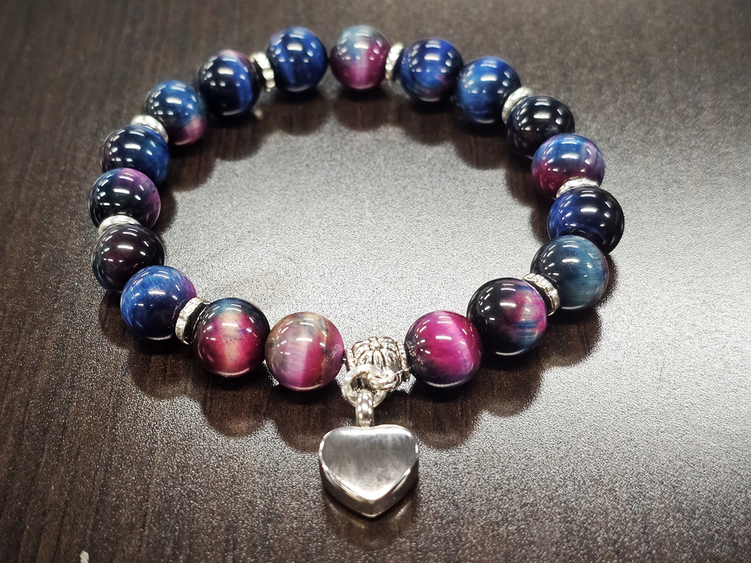Rainbow Tiger Eye beads bracelet with a central silver heart keepsake charm for ashes at home