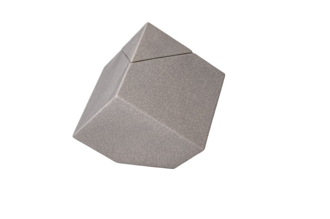 Beige crackle glaze Abstract Ceramic Urn with a pyramid lid shown at an angle.
