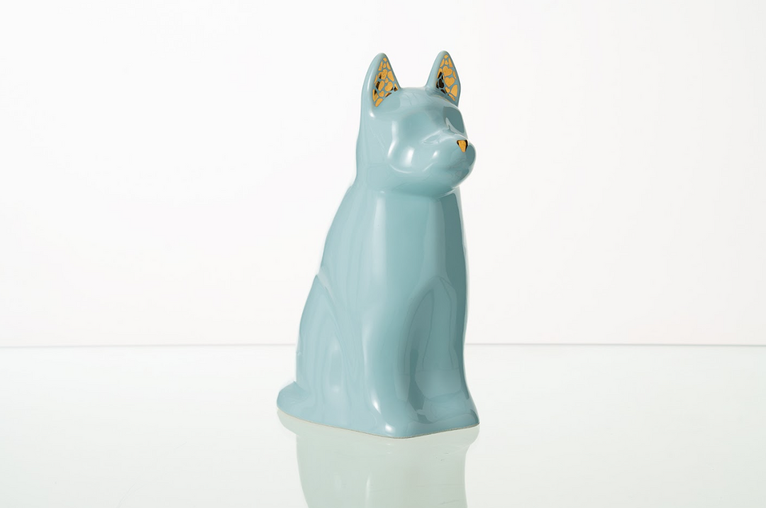 Teal Barkley Dog Ceramic Urn with gold lattice ear details on a clean white surface