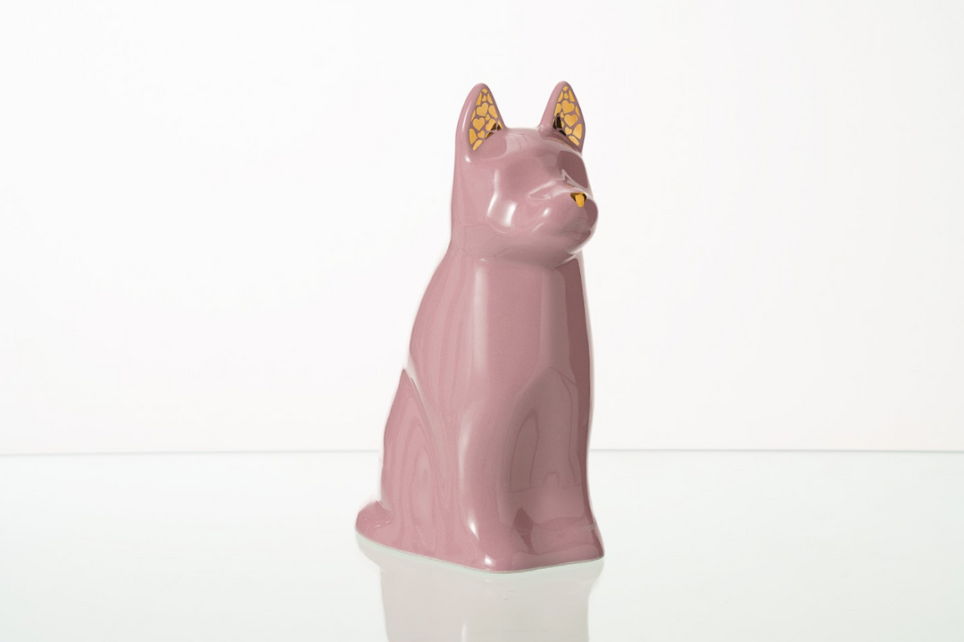 Lavender pink dog shaped ceramic urn with gold patterned ears