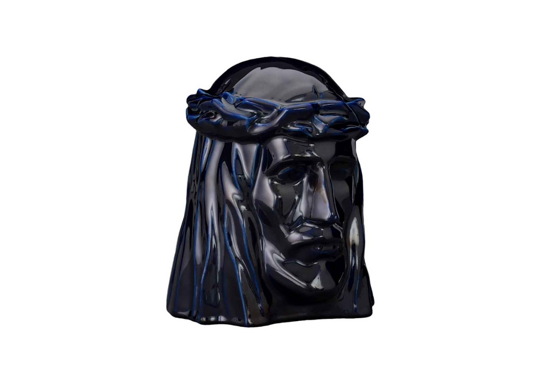 Dark navy glazed ceramic Christ head urn with crown of thorns, glossy finish