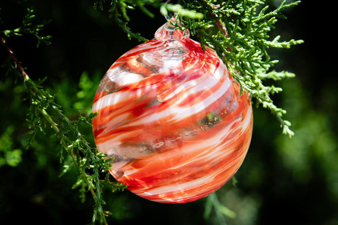 Christmas glass ornament with ash