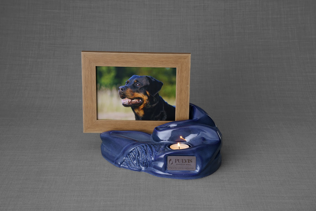 Blue Cozy ceramic urn with a built in candle and a picture frame showing a dog portrait.