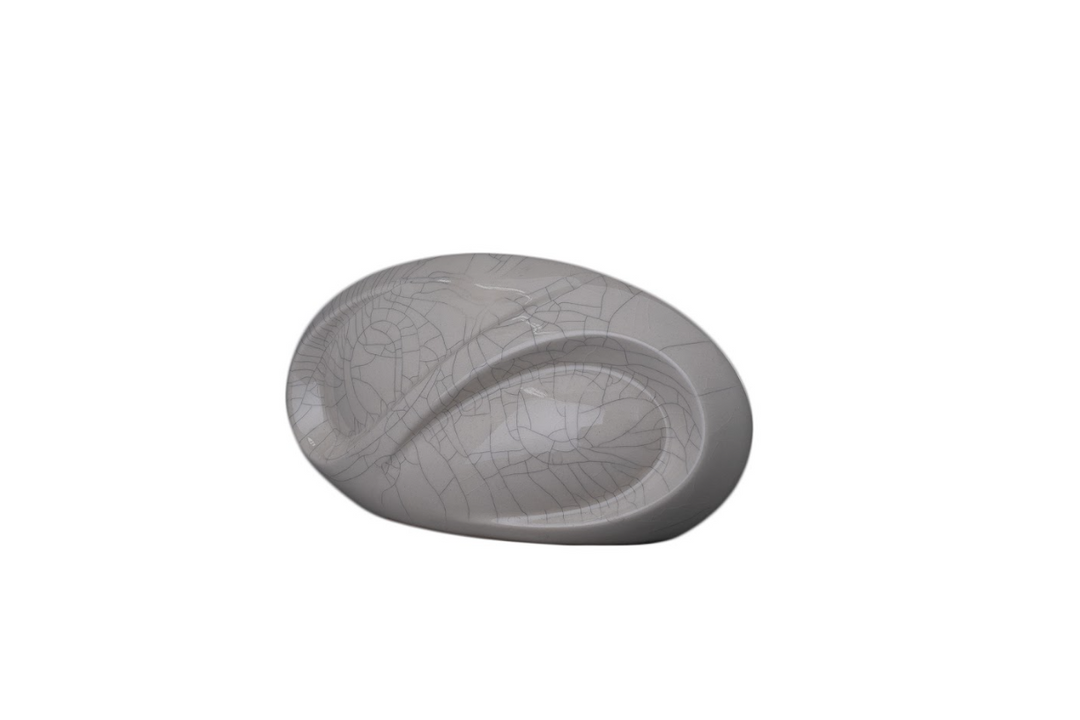 White crackled ceramic urn with flowing curved lines and built in candle holder