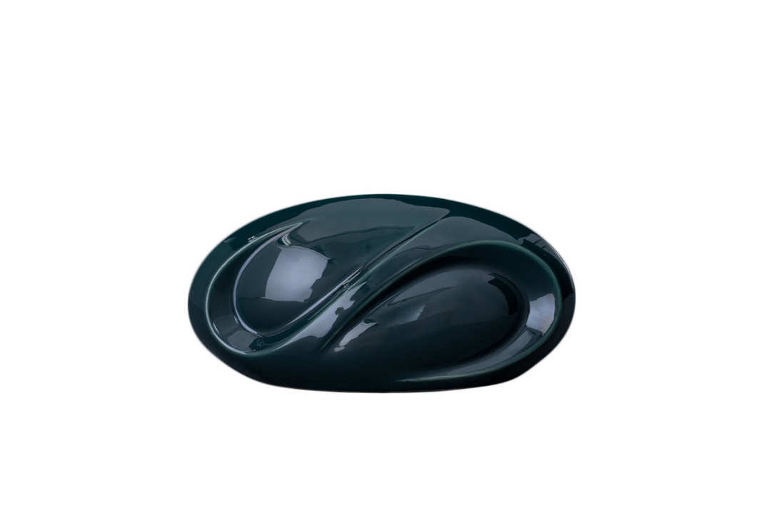 Glossy dark teal Eternity ceramic urn with infinity inspired curves and a built in candle holder.