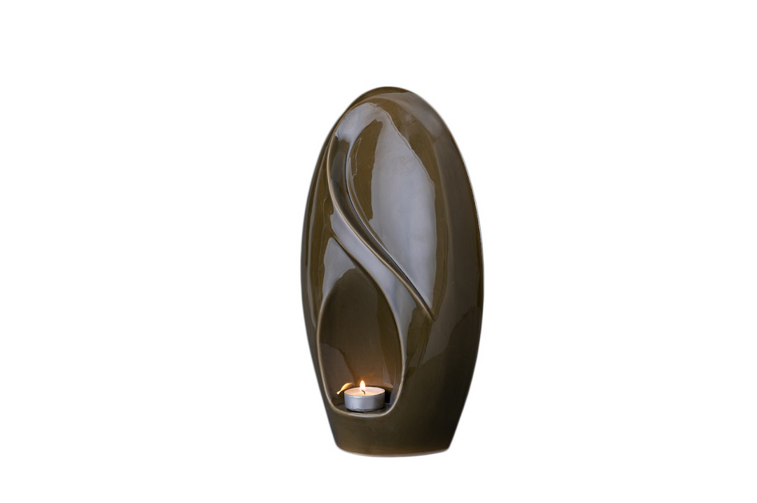 Olive glaze Eternity urn with a built in candle holder and flowing curved design