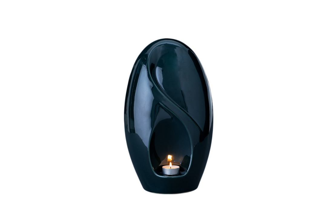 Teal Eternity urn with a built in candle holder and sculpted curved surface