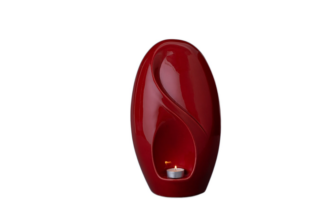 Red ceramic Eternity urn with built in candle holder and flowing sculptural lines