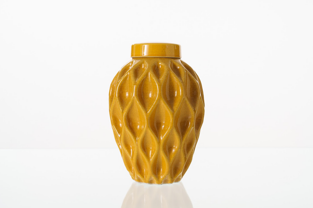 Golden Echo 3D printed ceramic urn with flowing diamond lattice pattern and lid