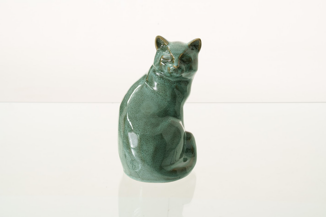 Green glazed ceramic cat urn with a seated feline form for a lasting memorial
