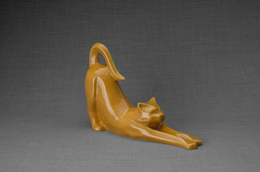 Grace Cat Ceramic Urn in amber glaze showing a stretching cat memorial