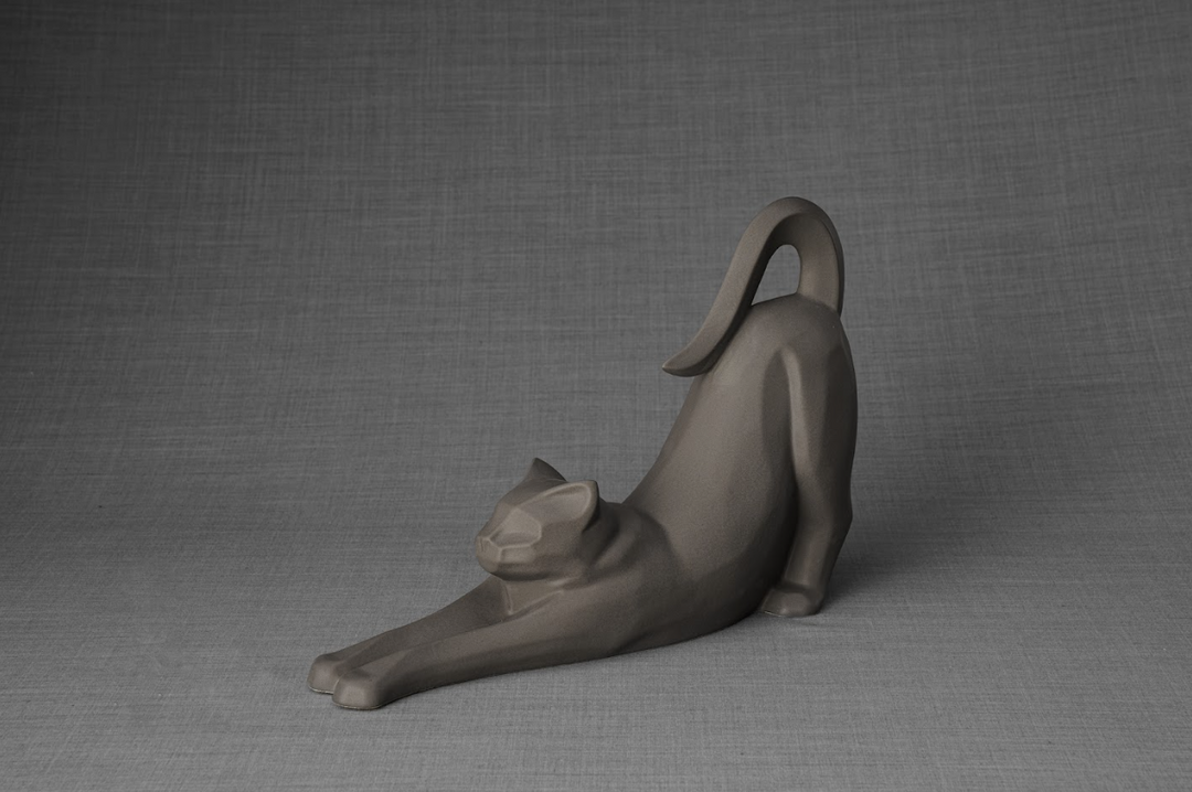 Grace Cat Ceramic Urn in muted gray matte glaze showing a stretching cat with a curved tail.