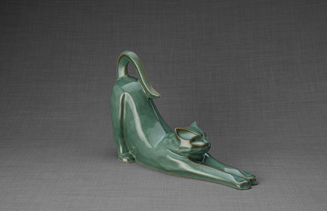 Grace cat ceramic urn in glossy green glaze with a stretching cat and a kitten beside its front legs