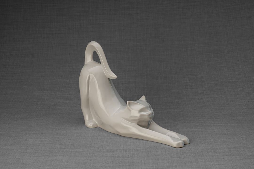 Grace cat ceramic urn in creamy glaze featuring a reclining cat and a kitten by its front legs