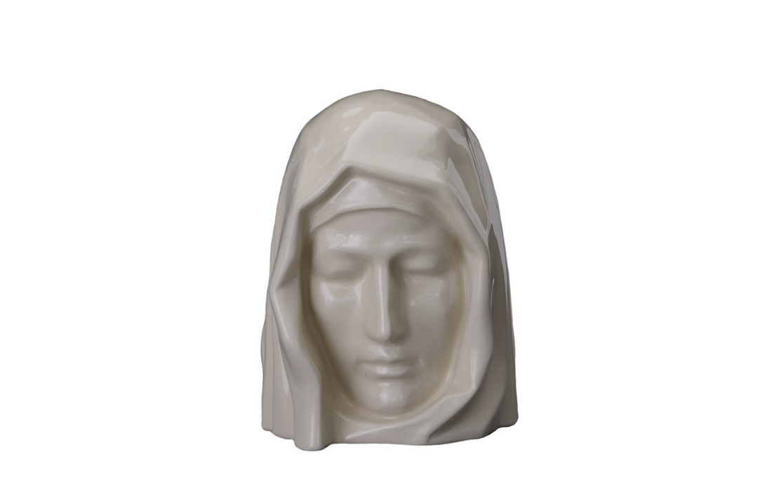 White ceramic Holy Mother urn bust with veiled head and serene expression.