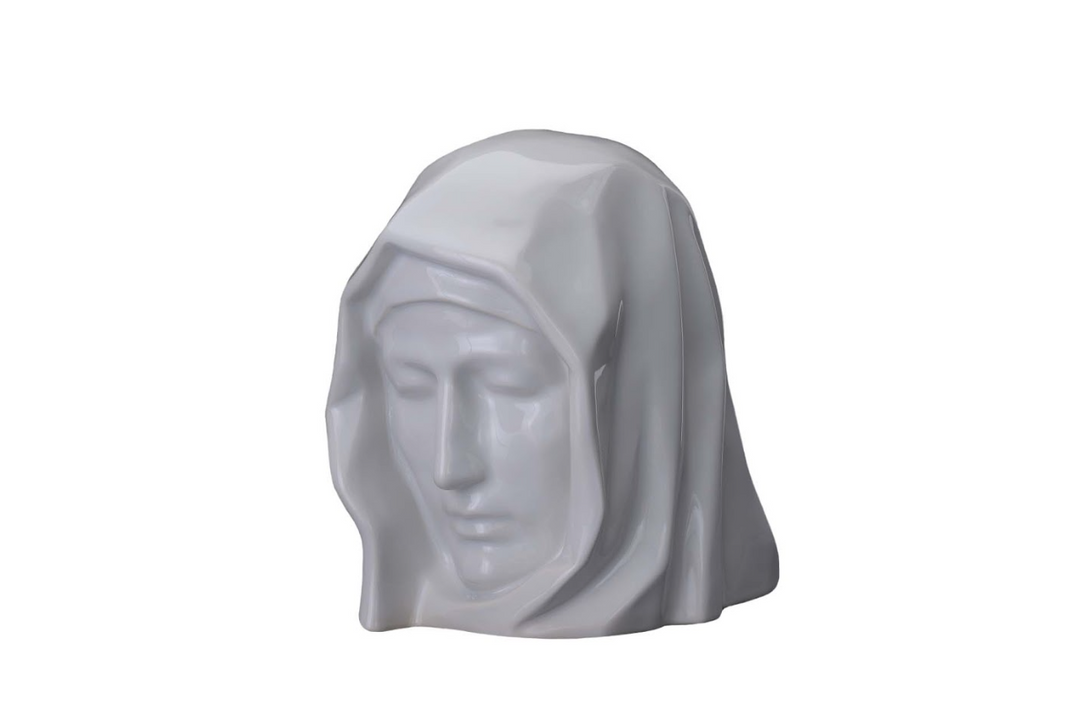 White ceramic Holy Mother urn sculpture with veiled head and serene facial features.