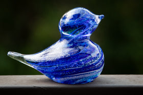 glass blue bird with cremation ash