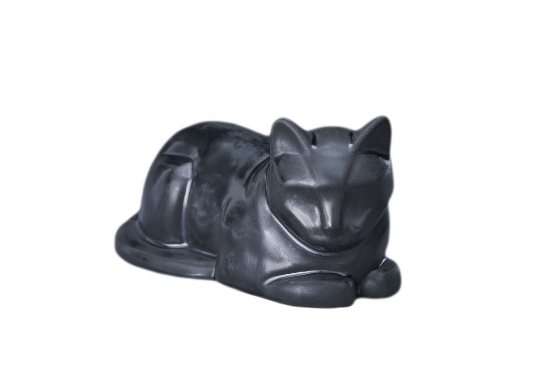 Dark glaze laying cat ceramic urn in a sleeping pose