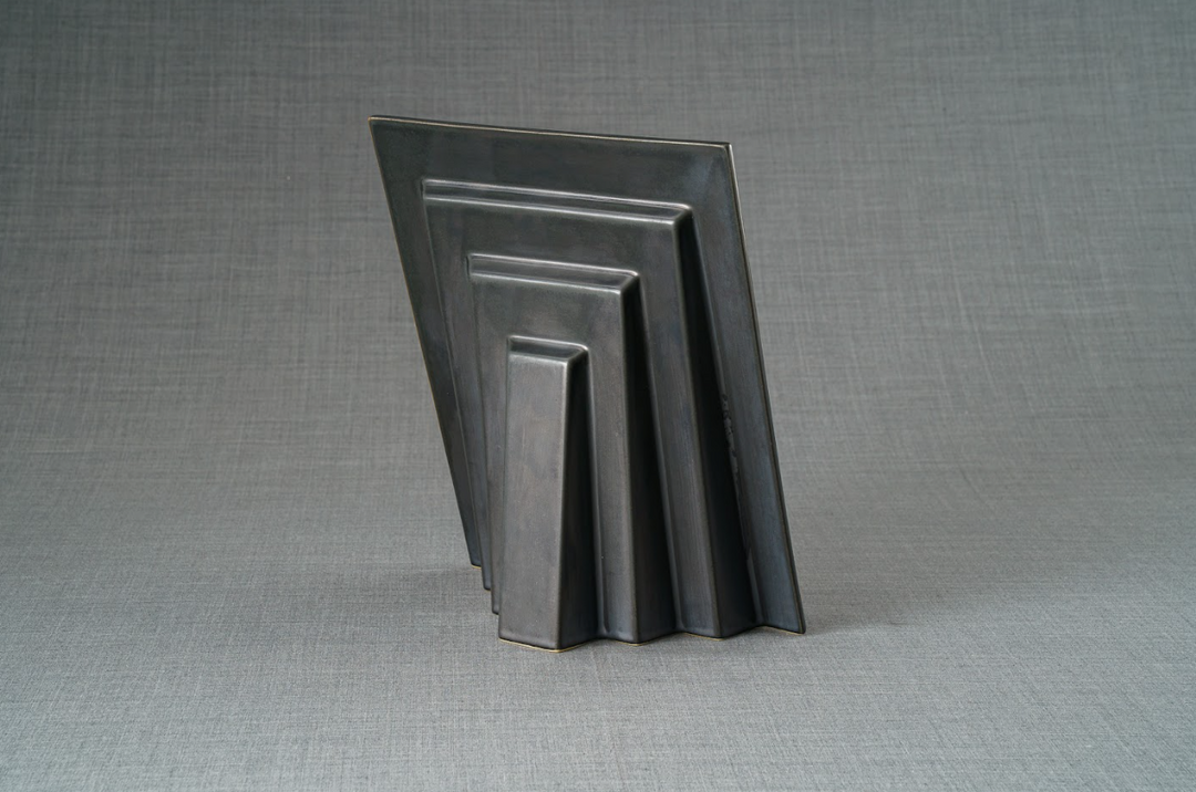 Side view of a dark Labrador Frame with layered rectangular panels.