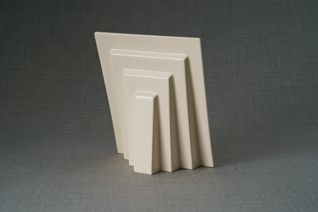 Set of cream nested picture frames in varying sizes.